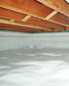 a moisture barrier installed on the walls and floors of a crawl space in Bountiful