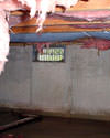 Utah, Idaho, and Wyoming crawl space with vents, showing mold, rot, and fiberglass insulation dripping off the ceiling.