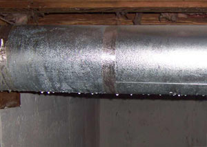 condensation collecting on an HVAC vent in a humid Twin Falls basement