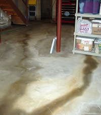 Flooding entering a basement through a floor crack in Midvale