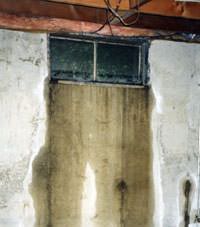 Flooding through basement windows in a Park City home.