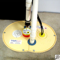 A sump pump system installed along a basement floor in Salt Lake City.