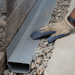 installing a drain tile system in a Draper home